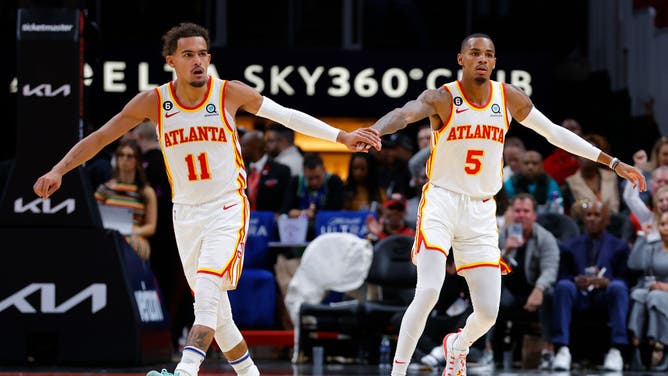 Atlanta Hawks guards Trae Young and Dejounte Murray dap each other up after a bucket against the Orlando Magic at State Farm Arena in Atlanta.