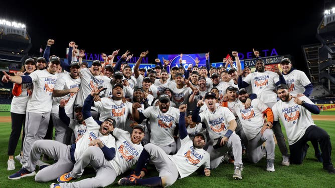 The Houston Astros pose for a photo at Yankee Stadium after beating the New York Yankees in Game 4 of the ALCS.
