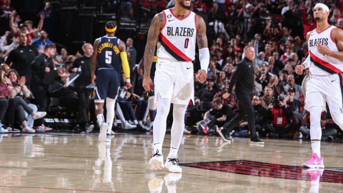 Portland Trail Blazers Damian Lillard pumps up the home crowd against the Denver Nuggets at the Moda Center Arena in Portland, Oregon.