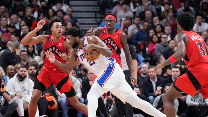 Philadelphia 76ers Joel Embiid trying to create for himself against Toronto Raptors forwards Scottie Barnes and Pascal Siakam at the Scotiabank Arena in Toronto, Canada.