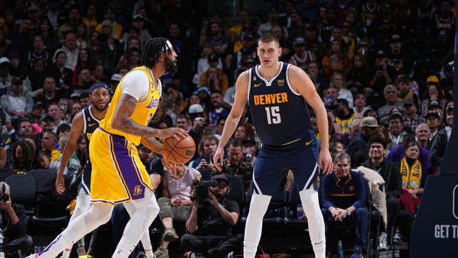 Denver Nuggets big Nikola Jokic plays defense on Los Angeles Lakers big Anthony Davis during the game at the Ball Arena in Denver, Colorado.