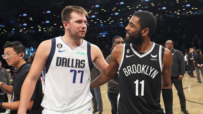 Dallas's Luka Doncic talks to future teammate Kyrie Irving after a Mavericks-Nets game at Barclays Center in Brooklyn, New York.