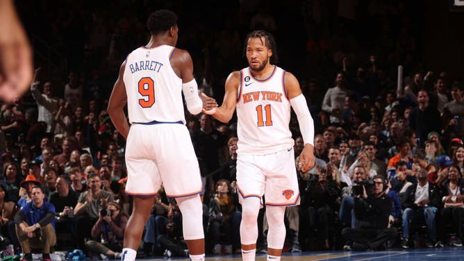 New York Knicks SF RJ Barrett high-fives PG Jalen Brunson against the Boston Celtics at Madison Square Garden.