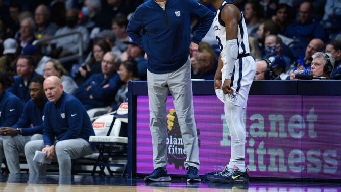 Butler Bulldogs SG Chuck Harris talks to head coach Thad Matta on the sidelines during a game with the New Orleans Privateers on November 7, 2022, at Hinkle Fieldhouse in Indianapolis.