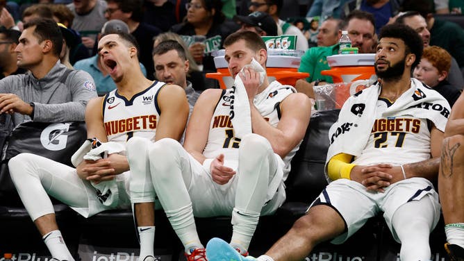 Denver Nuggets' Michael Porter, Nikola Jokic and Jamal Murray look on late in the 4th quarter of their loss to the Boston Celtics at TD Garden in Boston.