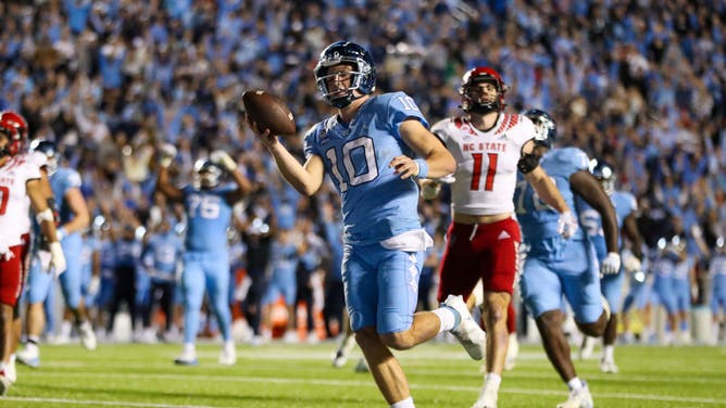 Maye runs for a TD during a game between the North Carolina and the North Carolina State Wolfpack.