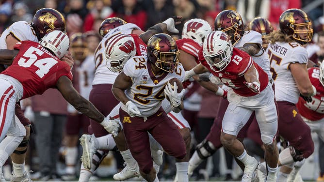 Minnesota Golden Gophers RB Mohamed Ibrahim hits the open hole against the Wisconsin Badgers at Barry Alvarez field at Camp Randall Stadium in Madison, Wisconsin.