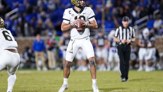 Wake Forest Demon Deacons QB Sam Hartman looks to pass the ball against the Duke Blue Devils on Nov 26, 2022 at Wallace Wade Stadium in Durham, North Carolina.