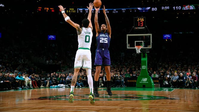 Charlotte Hornets PF P.J. Washington shoots a contested 3-pointer over Boston Celtics SF Jayson Tatum at the TD Garden in Boston.