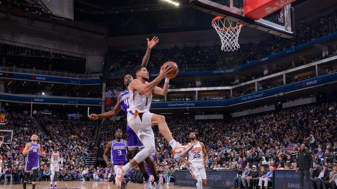 Devin Booker gets to the cup against the Kings at Golden 1 Center in Sacramento, California.