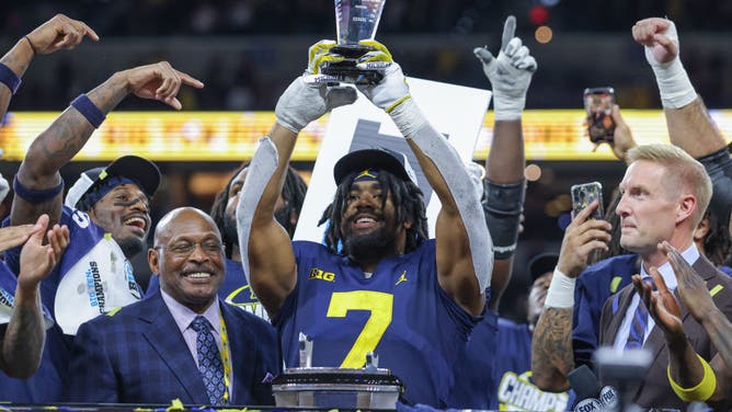 Michigan Wolverines RB Donovan Edwards holds the MVP trophy following the game against the Purdue Boilermakers in the Big Ten Championship at Lucas Oil Stadium in Indianapolis.