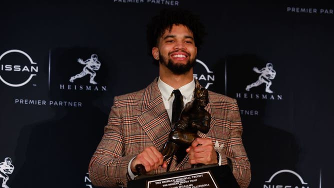USC Trojans QB Caleb Williams holds the Heisman Trophy after winning it during a press conference at the New York Marriott Marquis Astor Ballroom in New York City.
