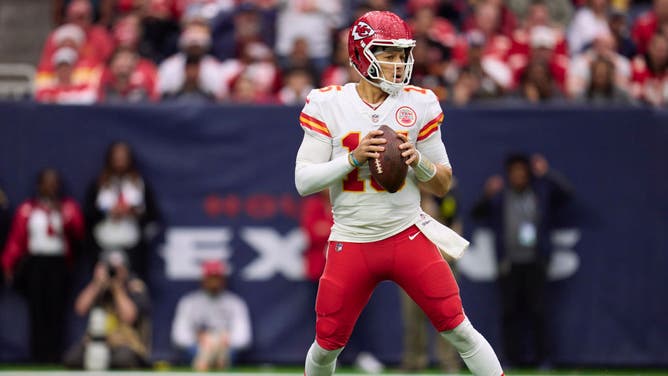 Patrick Mahomes drops back to pass against the Houston Texans during the first half at NRG Stadium in Houston, Texas.