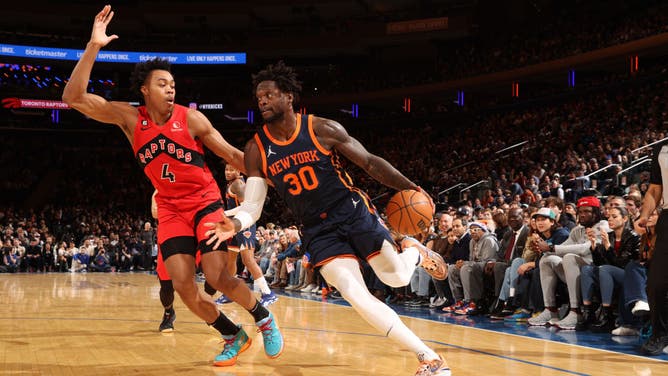 New York Knicks F Julius Randle drives to the basket past Toronto Raptors wing Scottie Barnes at Madison Square Garden.