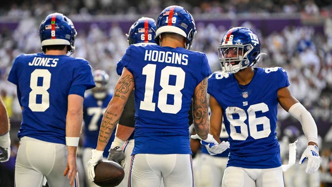 New York Giants wide receiver Isaiah Hodgins (18) celebrates his 8-yard touchdown reception with New York Giants wide receiver Darius Slayton (86) during the second quarter of a game between the Minnesota Vikings and New York Giants.