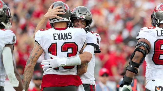 Buccaneers WR Mike Evans hugs Tom Brady after a TD catch vs. the Panthers at Raymond James Stadium in Tampa, Florida.