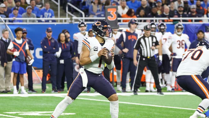 Chicago Bears quarterback Justin Fields looks for a receiver during an NFL football game against the Detroit Lions.
