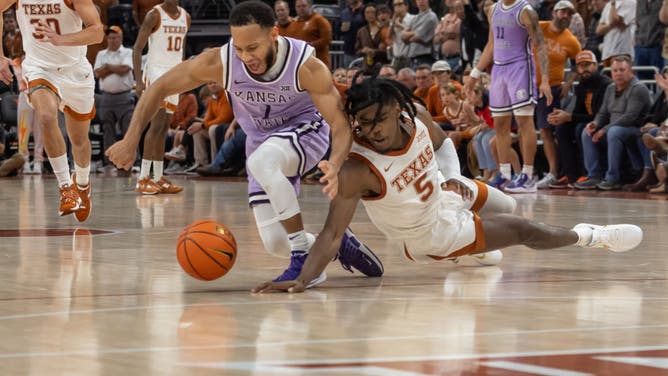 Kansas State Wildcats guard Markquis Nowell and Texas Longhorns guard Marcus Carr dives for a loose ball at Moody Center in Austin, Texas.