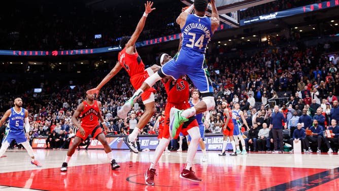 Giannis tries to put up a shot over the backboard vs. the Raptors at Scotiabank Arena in Toronto, Canada.