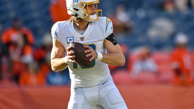 Los Angeles Chargers QB Justin Herbert warms up before a game against the Denver Broncos at Empower Field at Mile High in Denver, Colorado.