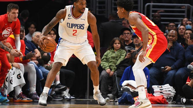 Clippers All-Star Kawhi Leonard is guarded by Hawks SF De'Andre Hunter at Crypto.com Arena in Los Angeles.