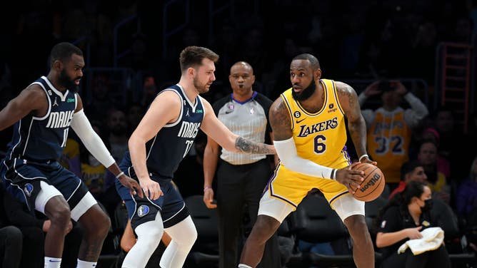 Luka Doncic defends LeBron James at Crypto.com Arena in Los Angeles.