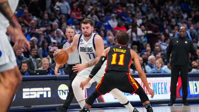 Mavericks' Luka Doncic drives to the basket around Hawks PG Trae Young at the American Airlines Center in Dallas, Texas.