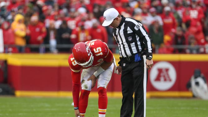 Chiefs QB Patrick Mahomes holds his ankle in pain in the AFC divisional playoff game at GEHA Field at Arrowhead Stadium.
