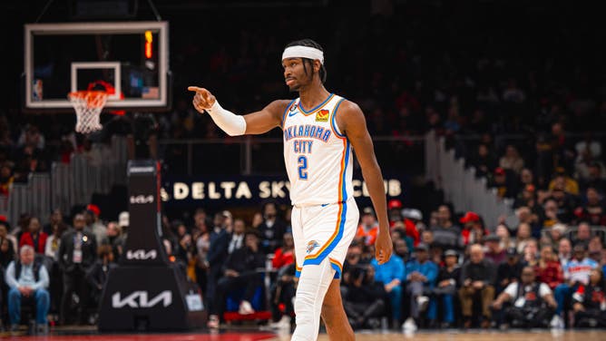 Thunder All-Star Shai Gilgeous-Alexander gestures towards his teammate in a game vs. the Hawks at State Farm Arena in Atlanta.