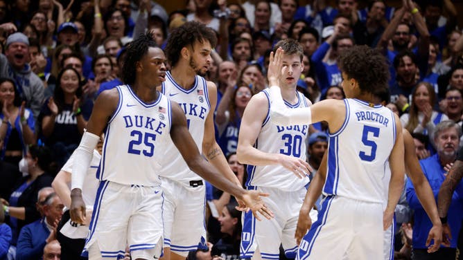Duke Blue Devils' Mark Mitchell, Dereck Lively II, Kyle Filipowski and Tyrese Proctor of the react following a play against the Wake Forest Demon Deacons at Cameron Indoor Stadium in Durham, North Carolina.