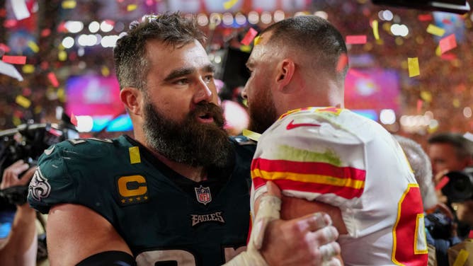 Jason Kelce of the Philadelphia Eagles speaks with Travis Kelce of the Kansas City Chiefs after Super Bowl LVII at State Farm Stadium on February 12, 2023 in Glendale, Arizona. The Chiefs defeated the Eagles 38-35.