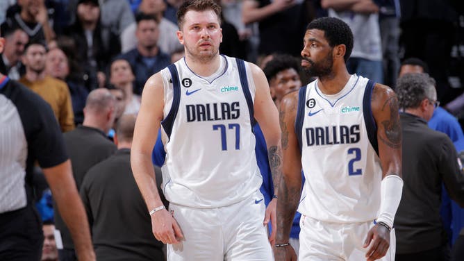 Luka Doncic and Kyrie Irving head back to the bench during the game vs. the Kings at Golden 1 Center in Sacramento, California.