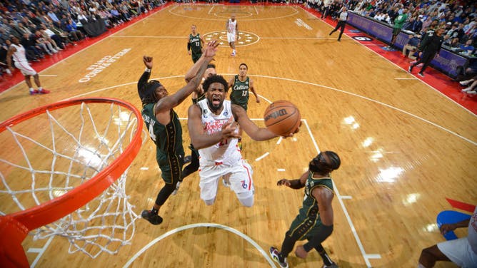 76ers big Joel Embiid drives to the basket against the Celtics at the Wells Fargo Center in Philadelphia.