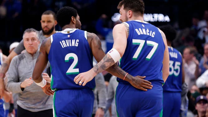 Mavericks' Kyrie Irving and Luka Doncic celebrate a bucket vs. the Philadelphia 76ers at American Airlines Center in Dallas, Texas.