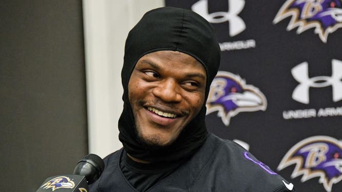 Likely former Baltimore Ravens quarterback Lamar Jackson smiles at the media.
