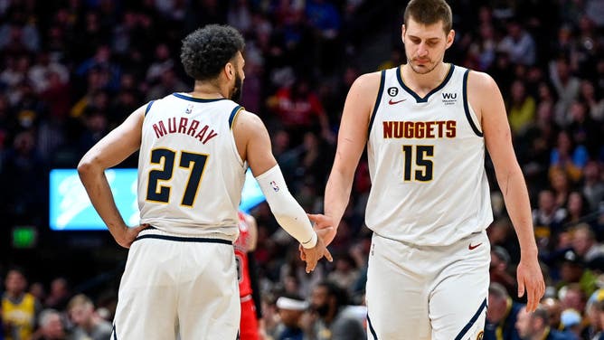 Jokic and Murray dap each other up against the Chicago Bulls at Ball Arena in Denver, Colorado.