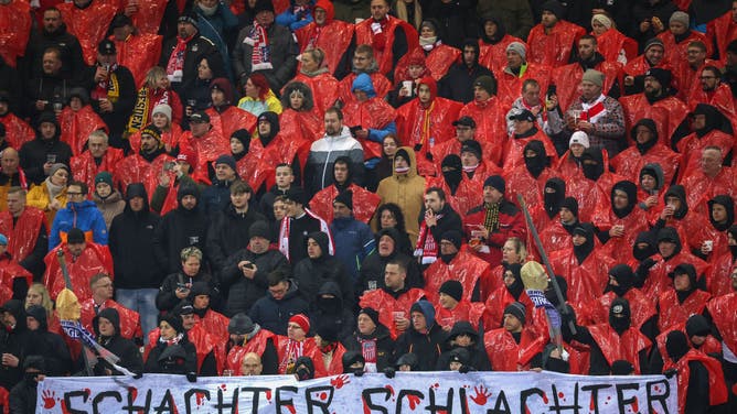 Supporters of Zwickau hold hanging doll heads with Aue scarfs and a banner reading Schachter Schlachter (engl. Aue Butcher) during the 3 Liga soccer match between FSV Zwickau and Erzgebirge Aue at GGZ Arena on March 14, 2023 in Zwickau, Germany.