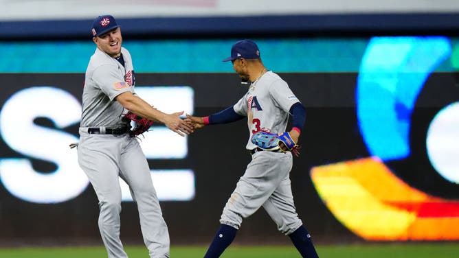 Mike Trout and Mookie Betts celebrate after USA defeated Venezuela in the 2023 World Baseball Classic Quarterfinal at loanDepot Park in Miami.