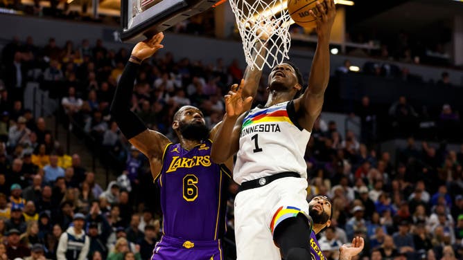 Timberwolves wing Anthony Edwards attacks the basket with Los Angeles Lakers' LeBron James at Target Center in Minneapolis.