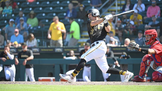 Drew Maggi of the Pittsburgh Pirates hits a single during the ninth inning of a spring training game against the Philadelphia Phillies at LECOM Park on March 21, 2023 in Bradenton, Florida.