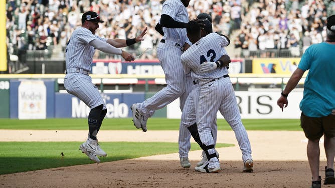 Members of the Chicago White Sox celebrate after Oscar Colás hits a walkoff single in the tenth inning during the game between the Baltimore Orioles and the Chicago White Sox at Guaranteed Rate Field on Saturday, April 15, 2023 in Chicago, Illinois.
