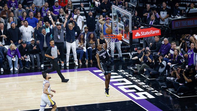 Kings PG De'Aaron Fox dunks the ball vs. the Warriors during Game 2 of the 2023 NBA Playoffs at Golden 1 Center in Sacramento, California.