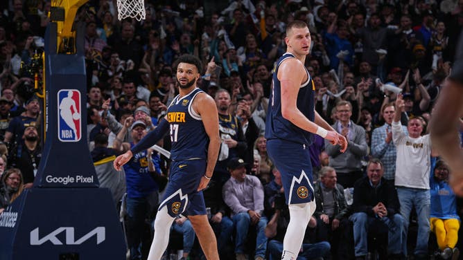 Nuggets C Nikola Jokic and PG Jamal Murray looks on vs. the Timberwolves during Game 2 of the 2023 NBA Playoffs at the Ball Arena in Denver, Colorado.