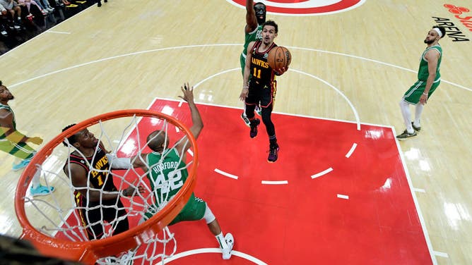 Hawks PG Trae Young drives to the basket vs. the Celtics in the 2023 NBA Playoffs at State Farm Arena.