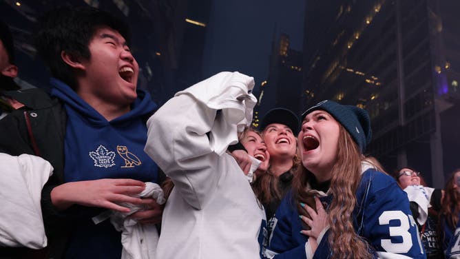 Toronto Maple Leafs fans at Maple Leaf Square celebrate the team's Game 6 victory over the Tampa Bay Lightning.