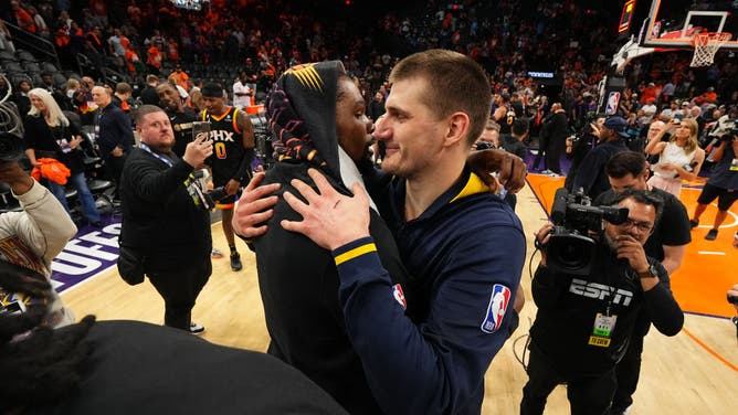 Kevin Durant of the Phoenix Suns and Nikola Jokic of the Denver Nuggets embrace after the Nuggets eliminate the Suns in the Western Conference playoffs.