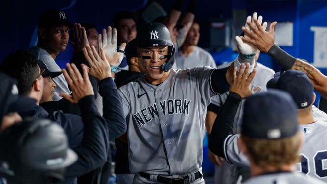 Aaron Judge of the New York Yankees celebrates a solo home run in the dugout during the eighth inning of their MLB game against the Toronto Blue Jays Monday night.