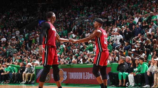 Heat big Bam Adebayo and Butler high-five during Game Two of the ECF vs. the Celtics at the TD Garden in Boston.