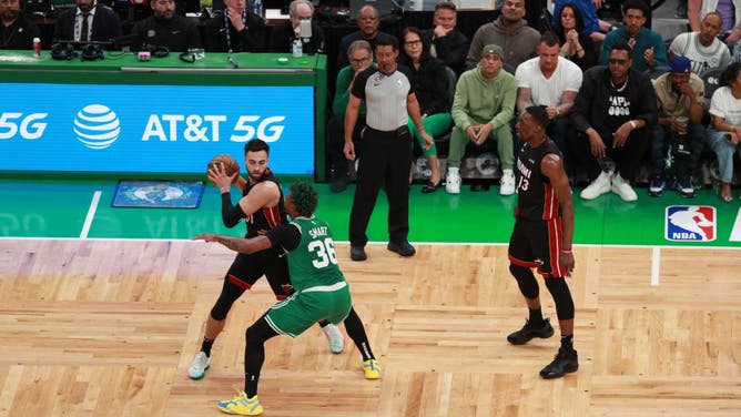 Heat SG Max Strus handles the ball with Celtics PG Marcus Smart playing defense during the Eastern Conference Finals at the TD Garden in Boston.