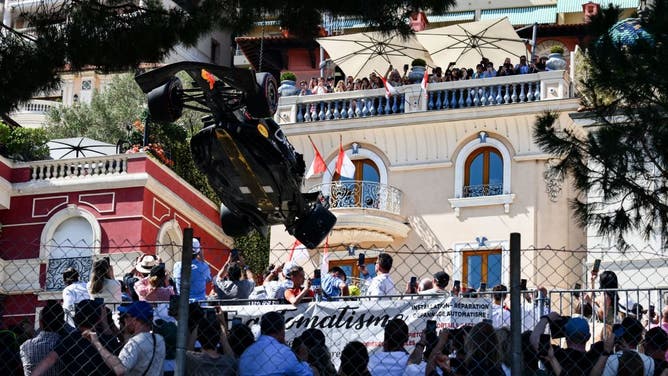 Sergio Perez car being removed by crane.
